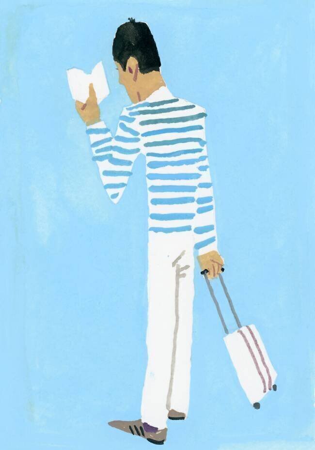 A traveler looking at the timetable Hiroyuki Izutsu