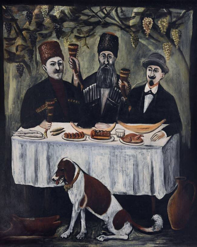 Feast in a vine pergola Niko Pirosmani