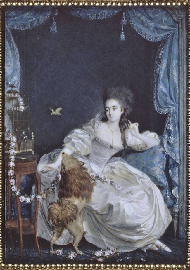 Jeune femme assise dans un intérieur avec un chien et un canari Pierre Chasselat