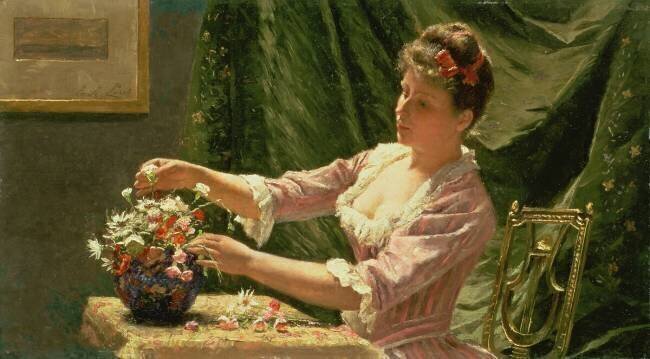 Jeune femme arrangeant des fleurs Emile Claus