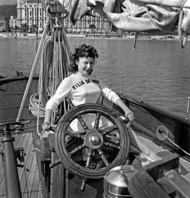 Claudine Dupuis on A Sailboat during Cannes Festival May 8, 1956 (b/w photo) Rue des Archives