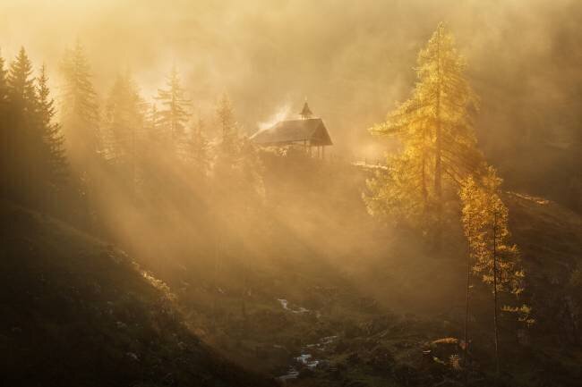 Alpine church in the morning fog Daniel Řeřicha