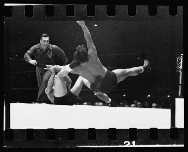Two men wrestling with a referee nearby Stanley Kubrick