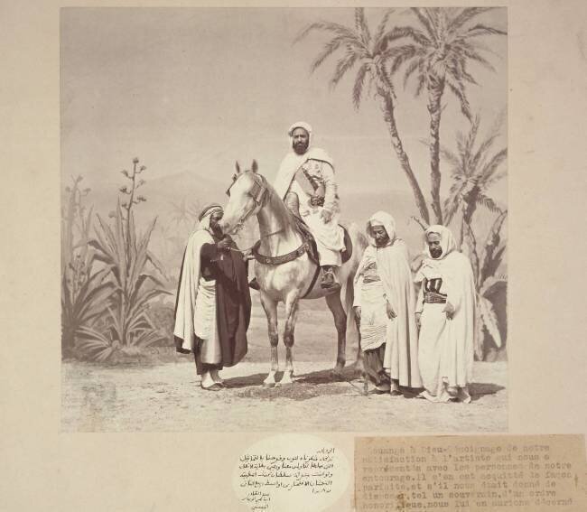 Portrait d'Abd el-Kader à cheval devant un décor de palmiers et d'agaves peint sur toile Louis Jean Delton