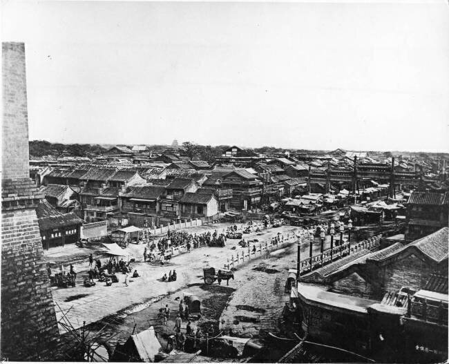 View of the Central Street in the Chinese Quarter of Peking John Thomson