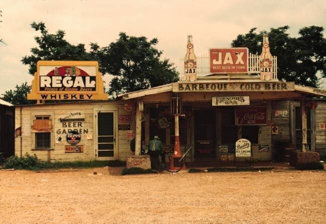 A cross roads store, bar, "juke joint," and gas station in the cotton plantation area, Melrose, La. Marion Post Wolcott