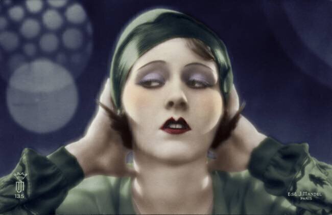 Close-up of a young woman with her hands behind her head anonymous