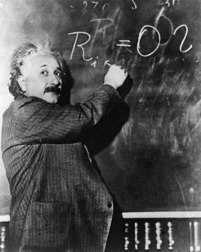 Einstein writing a mathematical formula on the blackboard Keystone