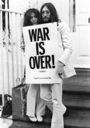John Lennon and his wife Yoko Ono pictured with one of their war protest poster (anonymous) - Muzeo.com