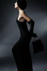 Young woman in black dress with hat, handbag and gloves (anonymous) - Muzeo.com