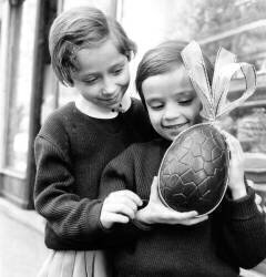 Children With Delicacy Chocolate Eggs For Easter (Rue des Archives) - Muzeo.com
