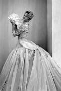 Brigitte Bardot Trying on A Dress By Balmain (Rue des Archives) - Muzeo.com