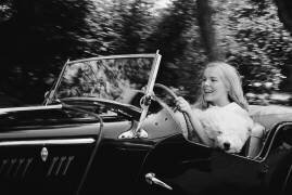 Janet Landgard driving with dog (Orlando Suero) - Muzeo.com