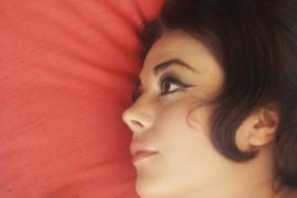 Natalie Wood at home with head on pillow (Orlando Suero) - Muzeo.com