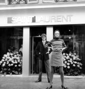 Yves Saint Laurent in Front of his Shop With One of his Models (Rue des Archives) - Muzeo.com