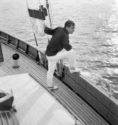 Charles Aznavour lors du Festival de Cannes le 9 mai 1959 à bord du « Bengali » (Rue des Archives) - Muzeo.com