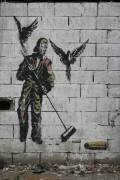 Graffiti d'homme balayant des balles (anonyme) - Muzeo.com