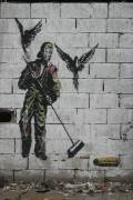 Graffiti d'homme balayant des balles (anonymous) - Muzeo.com