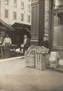Lena Lochiavo, 11 years old, basket and pretzel seller, at Sixth Street market in front of saloon entrance, Cincinnati, Ohio, August 1908 (Lewis Wickes Hine) - Muzeo.com