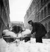 Man Clearing Away Snow in Paris Streets, 1946 (Rue des Archives) - Muzeo.com