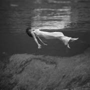 Woman floating underwater (anonymous) - Muzeo.com